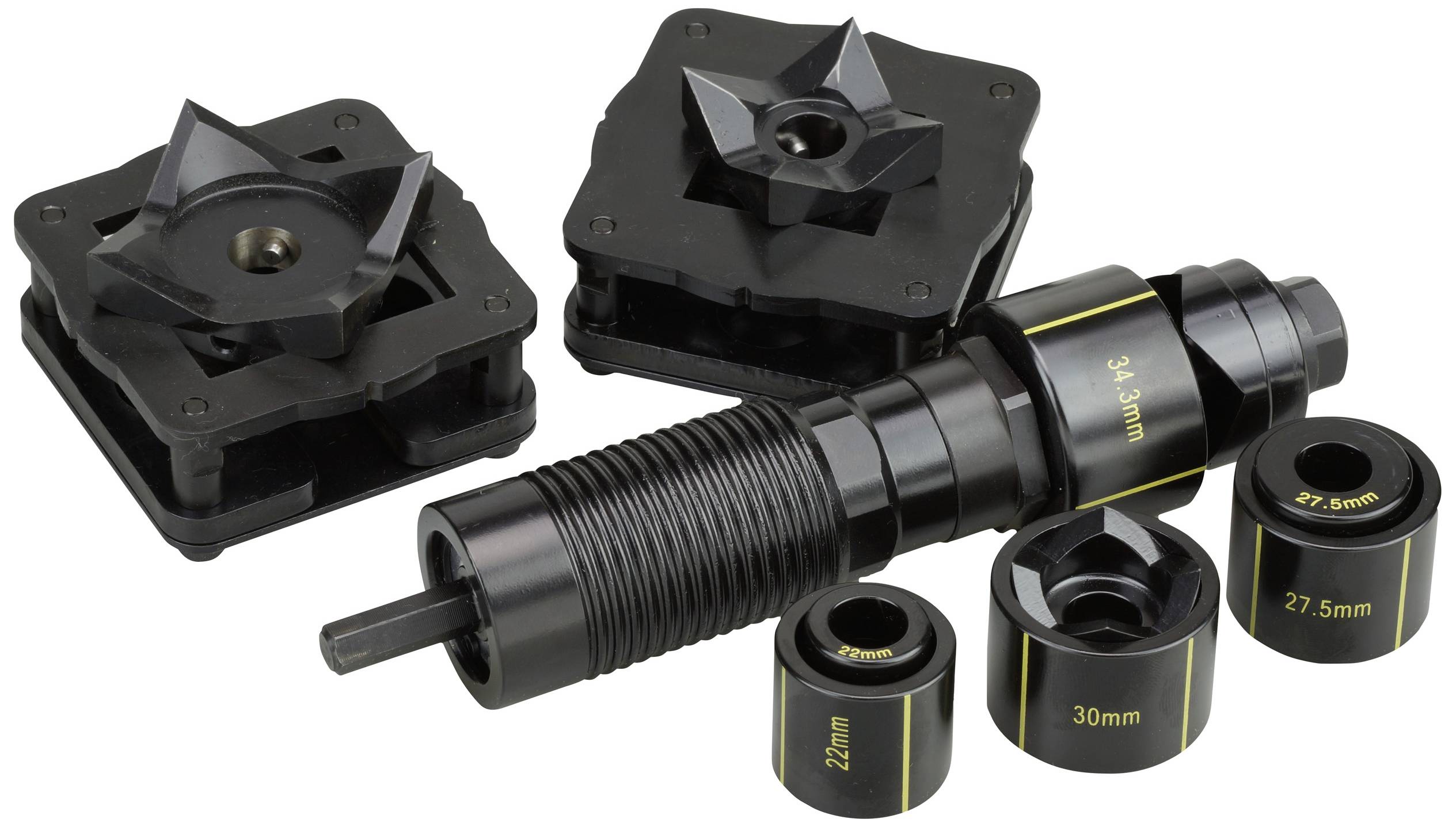 Ein Set mit verschiedenen Werkzeugen und Zubehör für die Kfz-Werkstatt, darunter Abstandshalter und Adapter in verschiedenen Größen.