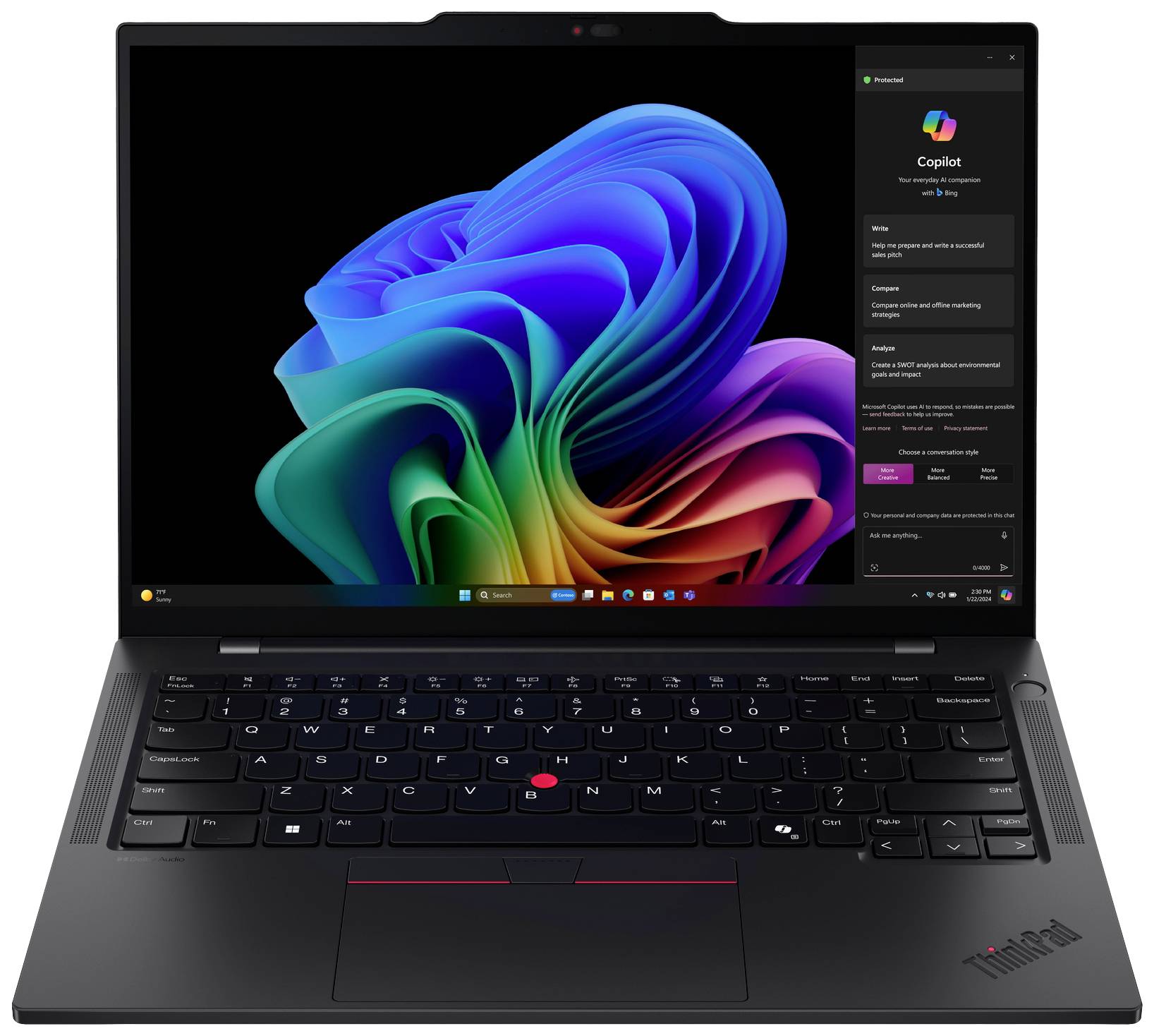 Ein schwarzer Laptop zeigt den Startbildschirm von Windows mit einem bunten, abstrakten Hintergrund.