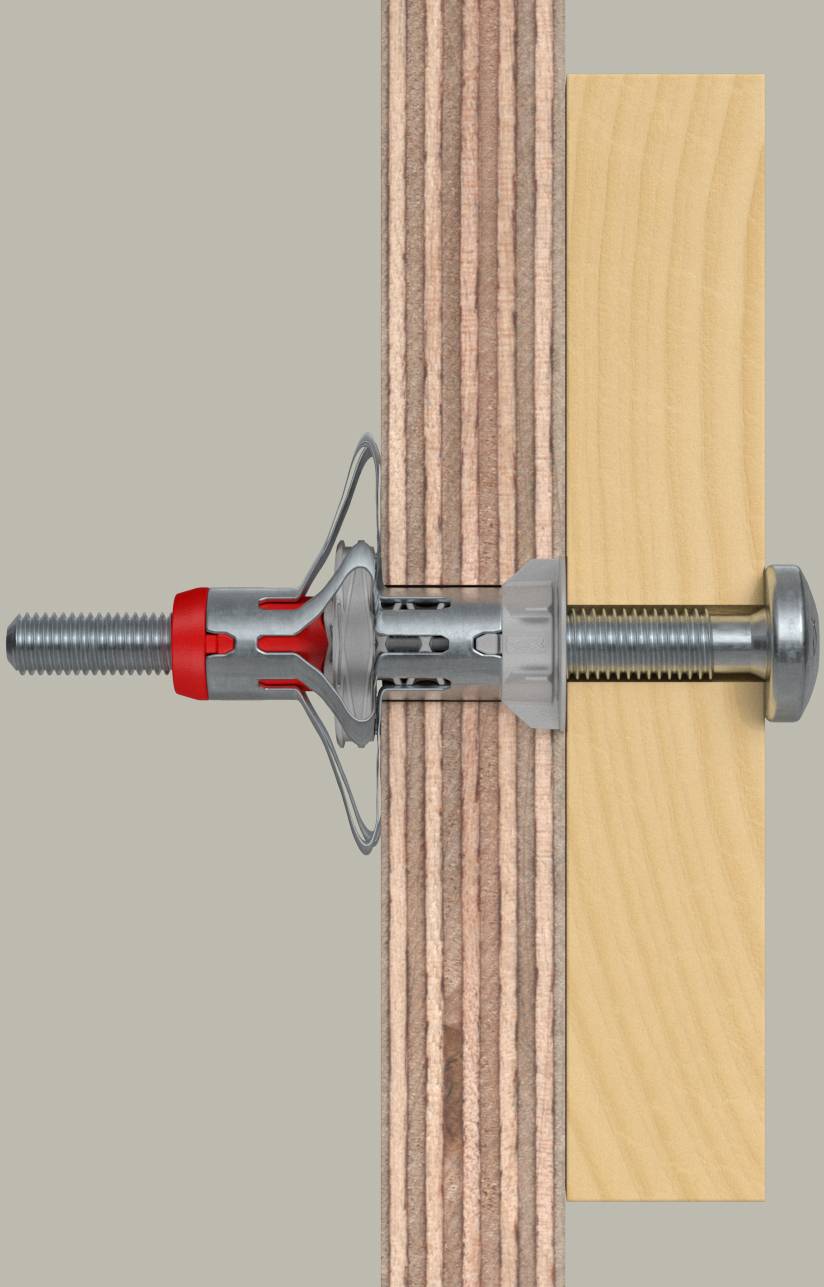 Schnittzeichnung einer Wandverankerung, die durch Gipskarton führt und ein Holzbrett befestigt. Die Verankerung expandiert, um die Wand zu greifen.