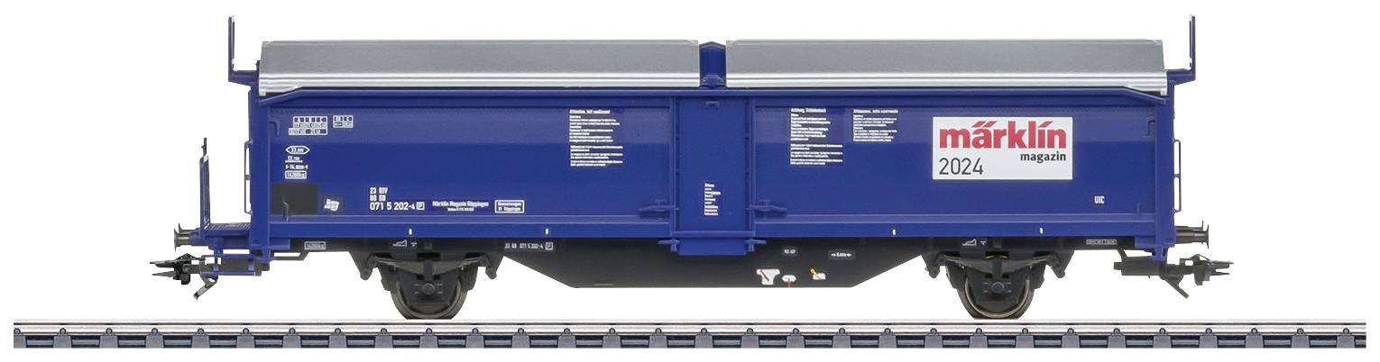 Blauer Güterwagen auf Gleis mit 'märklin magazin'-Logo und der Nummer 2024, seitliche Ansicht.