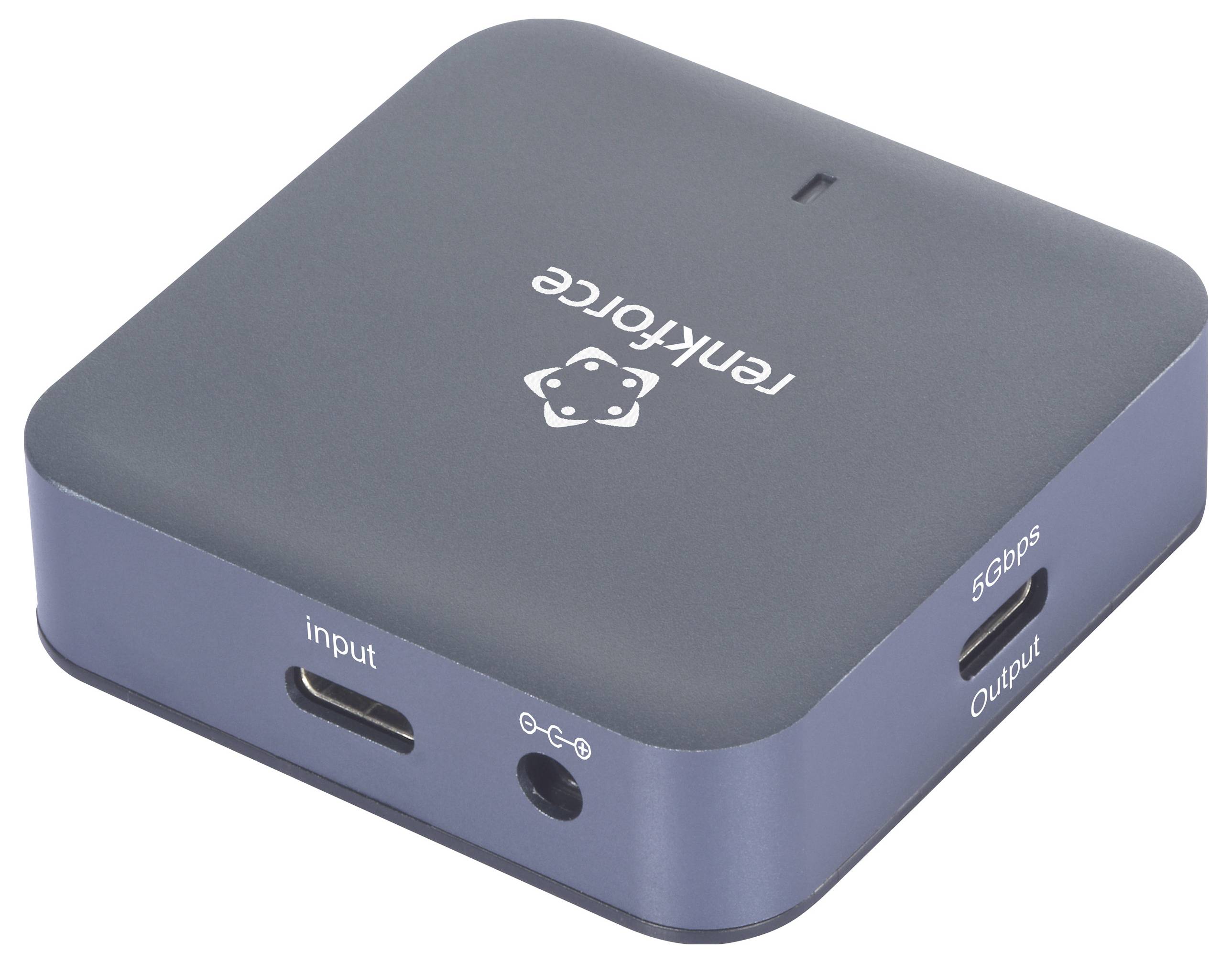 Ein schwarzer Adapter mit Beschriftung 'input' und 'output' auf der Vorderseite, möglicherweise für Übertragungszwecke.