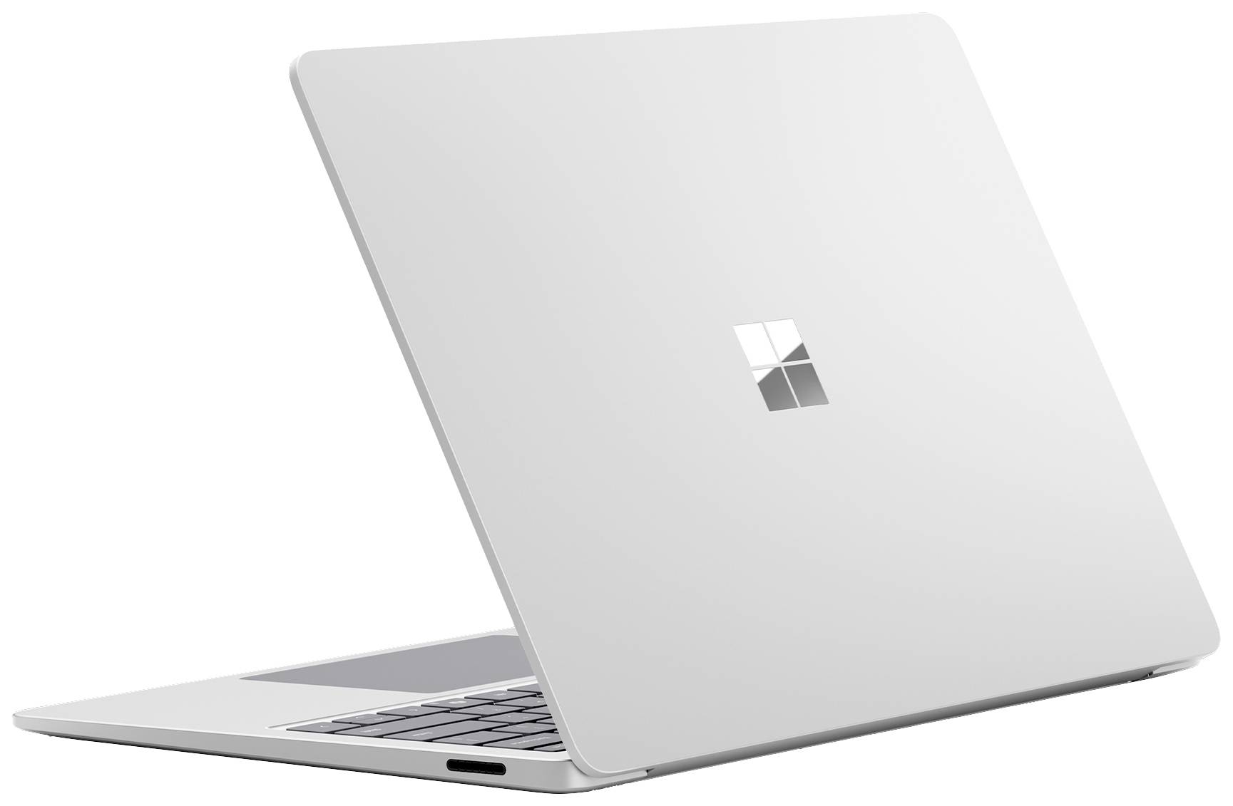 Silberner Laptop mit geöffnetem Deckel, zeigt das Microsoft-Logo. Entworfen für stilvolles Arbeiten.