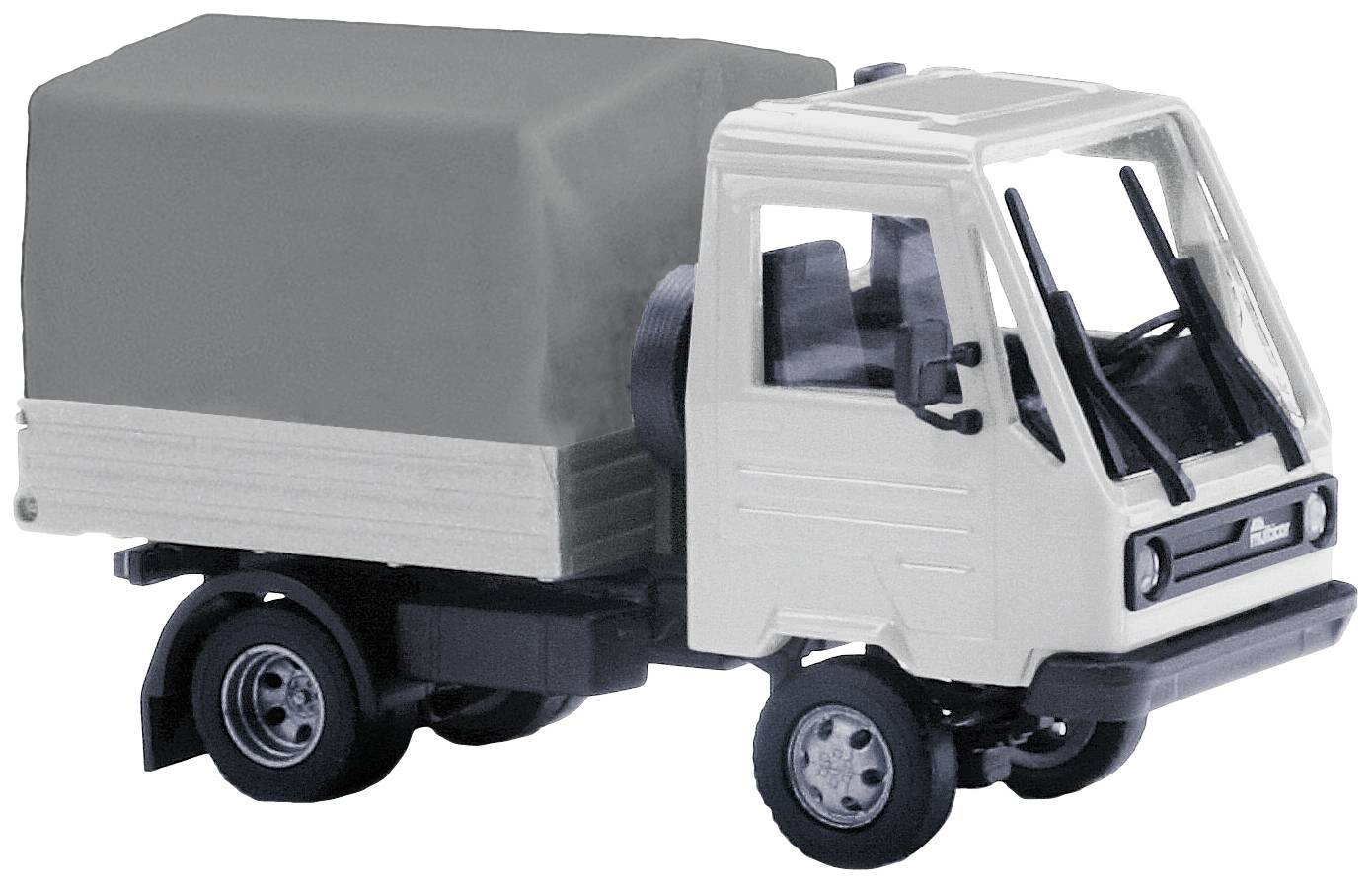 Ein weißes Modell-LKW-Fahrzeug mit schwarzem Dach und Anhänger steht auf einer glatten Oberfläche.