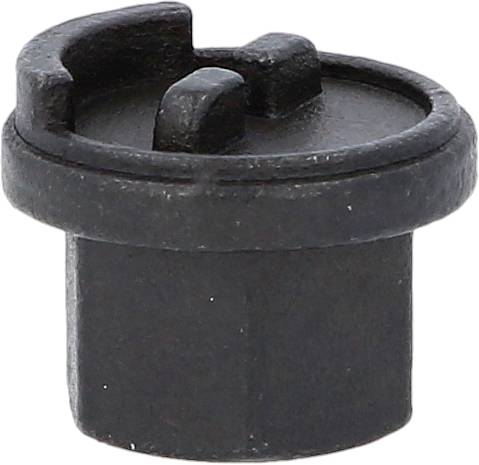 Ein schwarzes, zylindrisches Plastikteil mit erhöhtem Rand und zwei inneren Erhöhungen, oft verwendet als Verschluss oder Stopfen für eine Öffnung.