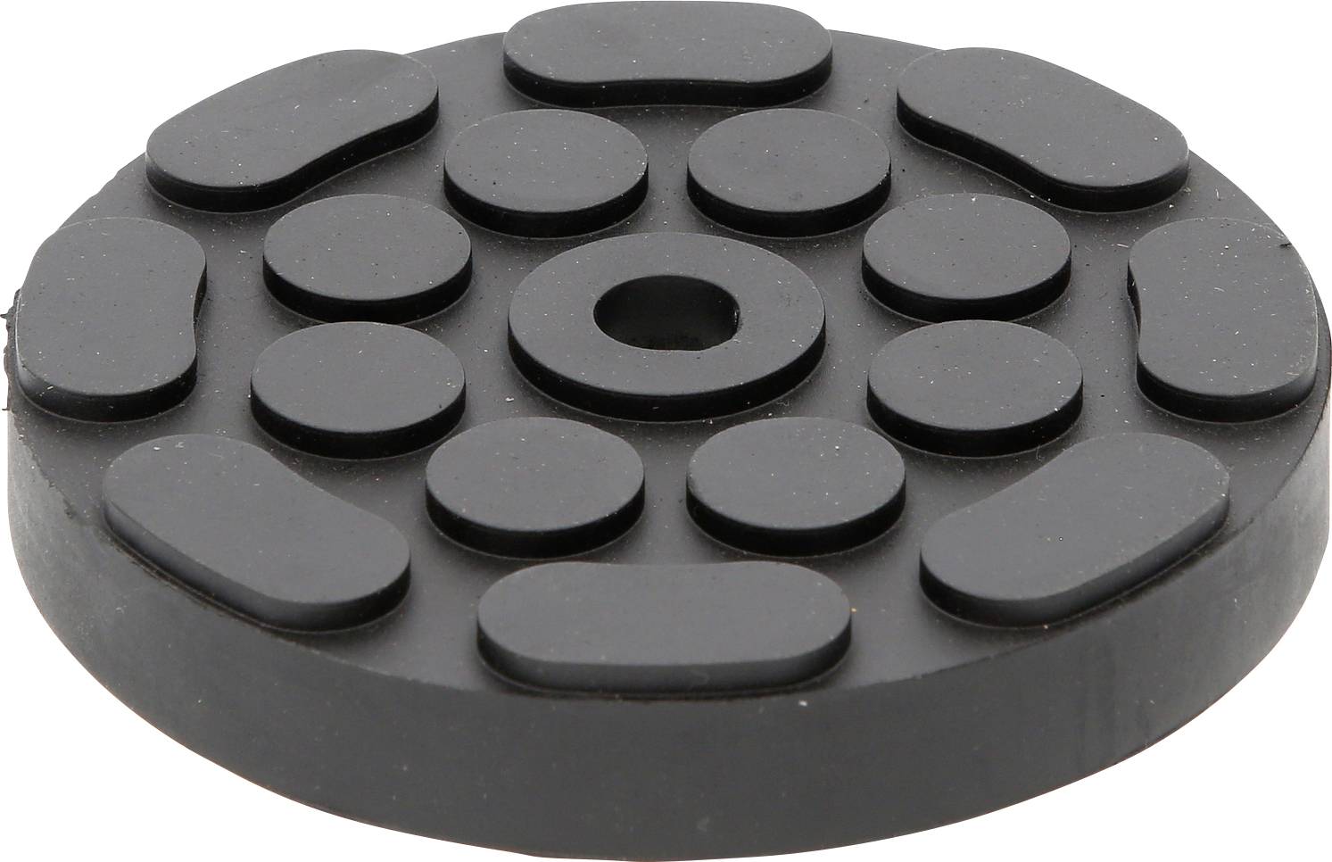 Schwarze, runde Gummischeibe mit mehreren erhabenen ovalen und kreisförmigen Elementen, die radial angeordnet sind.