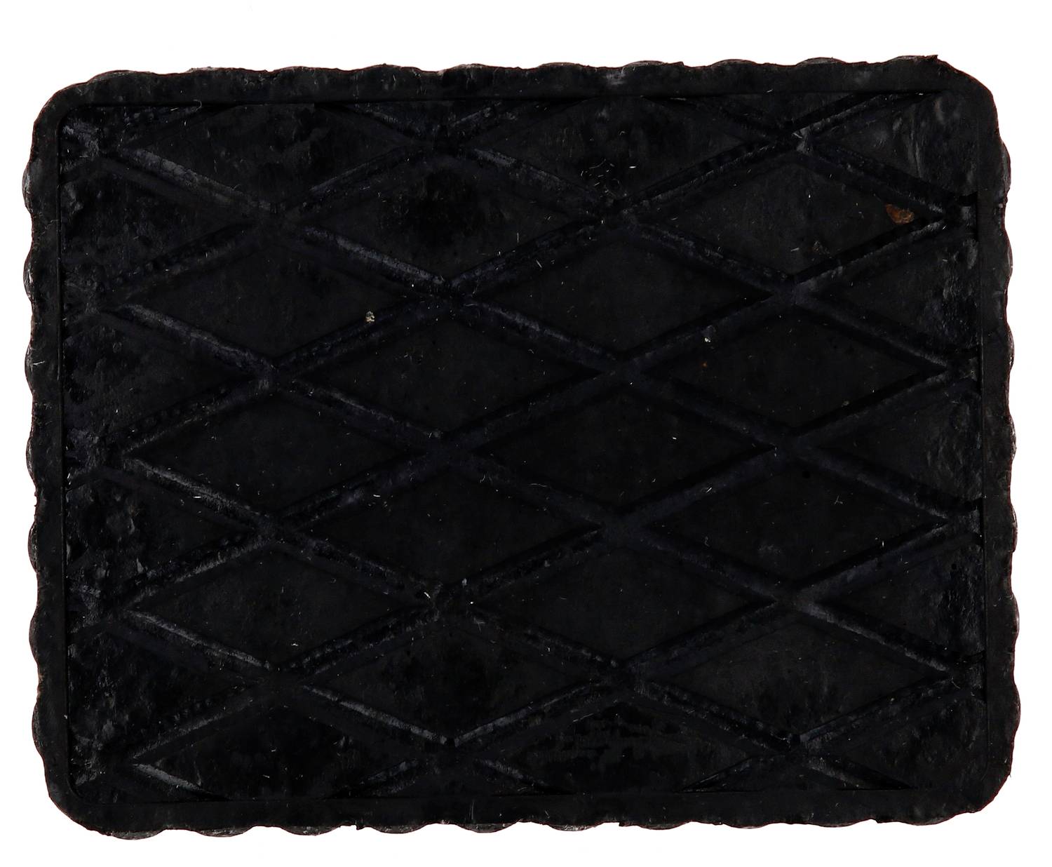 Rechteckiges schwarzes Gummipad mit rautenförmigem Muster.