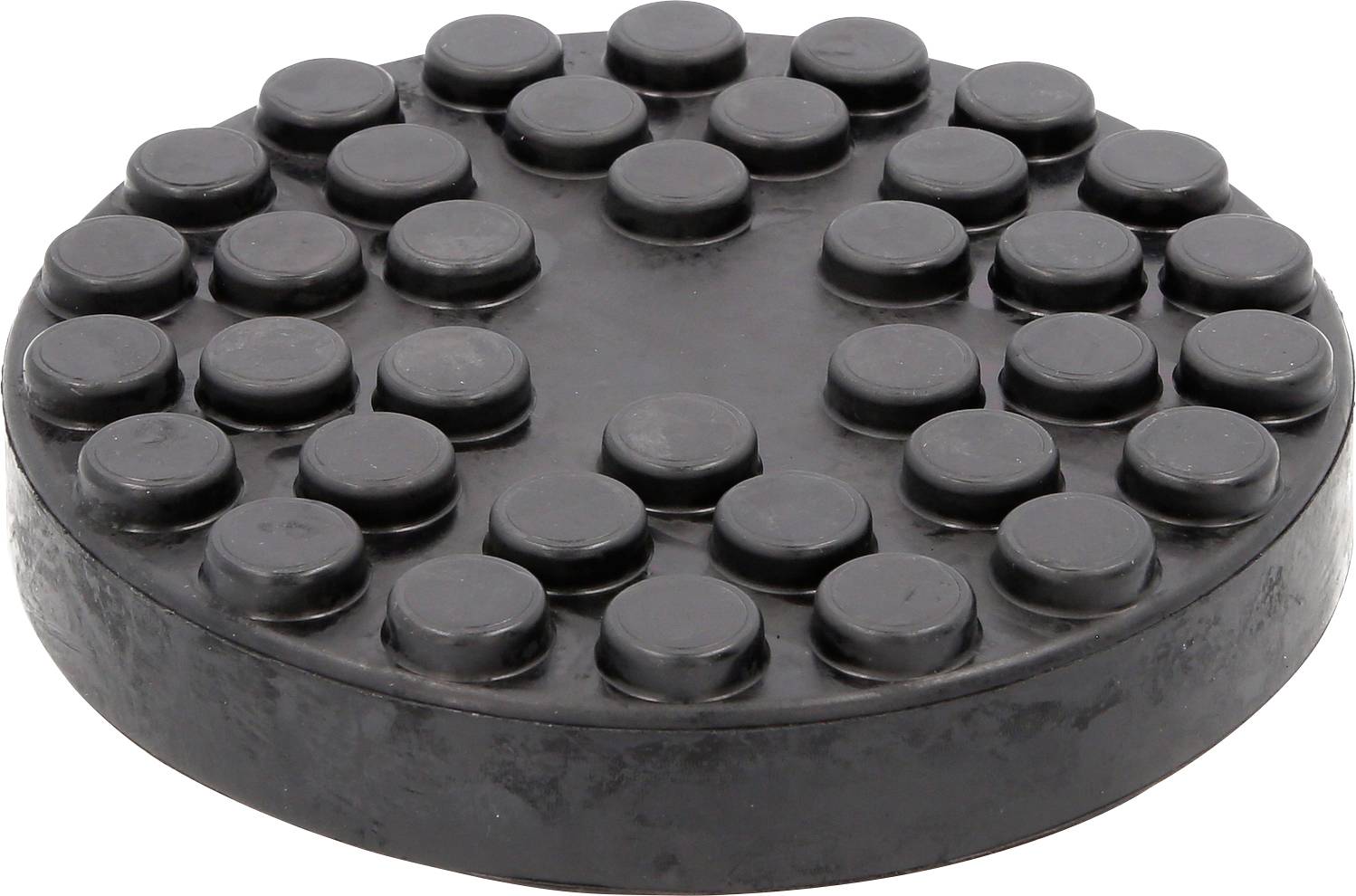 Runde, schwarze Gummischeibe mit 17 erhabenen Punkten auf der Oberseite, die gleichmäßig angeordnet sind.