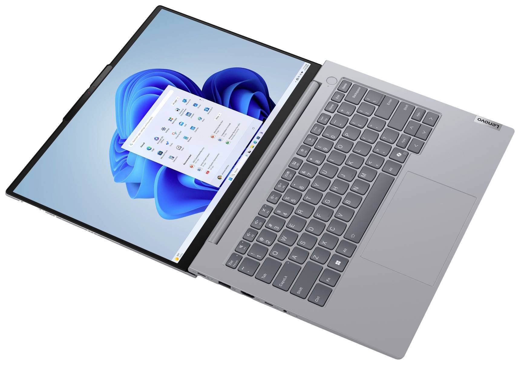 Ein grauer Laptop mit Windows-Oberfläche, Tastatur sichtbar. Der Bildschirm zeigt das Windows-Startmenü und blaue Designs.