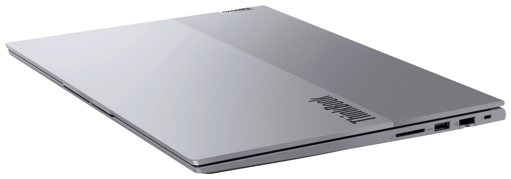 Ein grauer, geschlossener Laptop, von der Seite betrachtet, zeigt leicht gebogene Kanten und mehrere Anschlüsse.