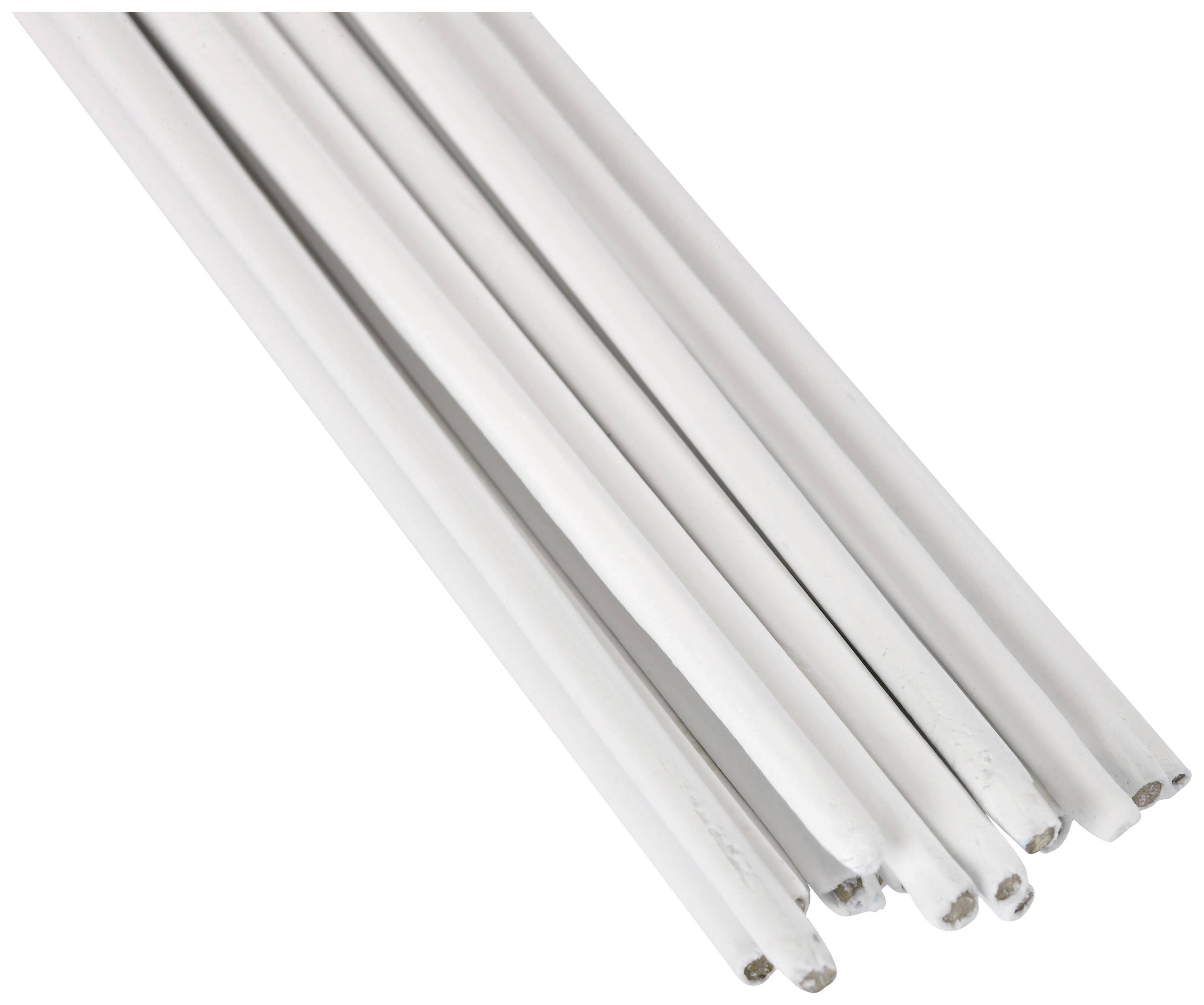 Weiße, runde Kerzenstummel, die nebeneinander liegend zu sehen sind.