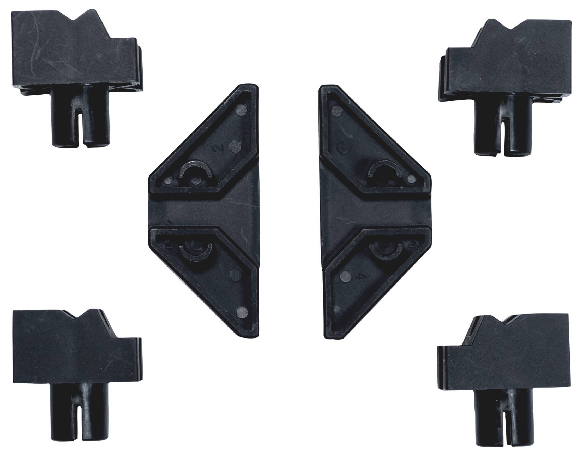 Fünf schwarze Kunststoff-Zubehörteile mit verschiedenen Formen, symmetrisch angeordnet auf weißem Hintergrund.