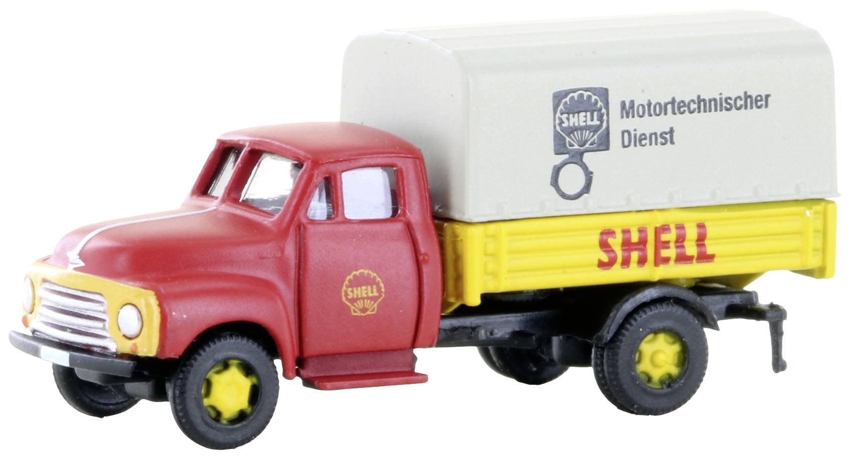 Spielzeugmodell eines historischen roten Shell-Lkw mit gelber Ladefläche und weißer Plane, Aufschrift 'Motortechnischer Dienst'.