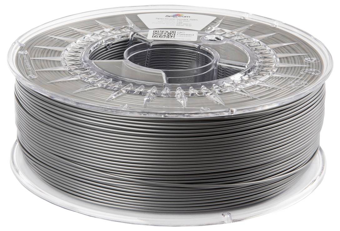 Spule mit grauem 3D-Druckerfilament aus Plastik.