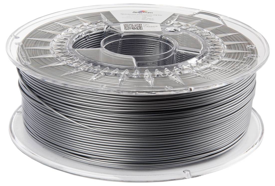 Eine Rolle graues 3D-Druckmaterial, ordentlich aufgewickelt und in eine durchsichtige Plastikspule eingespannt.