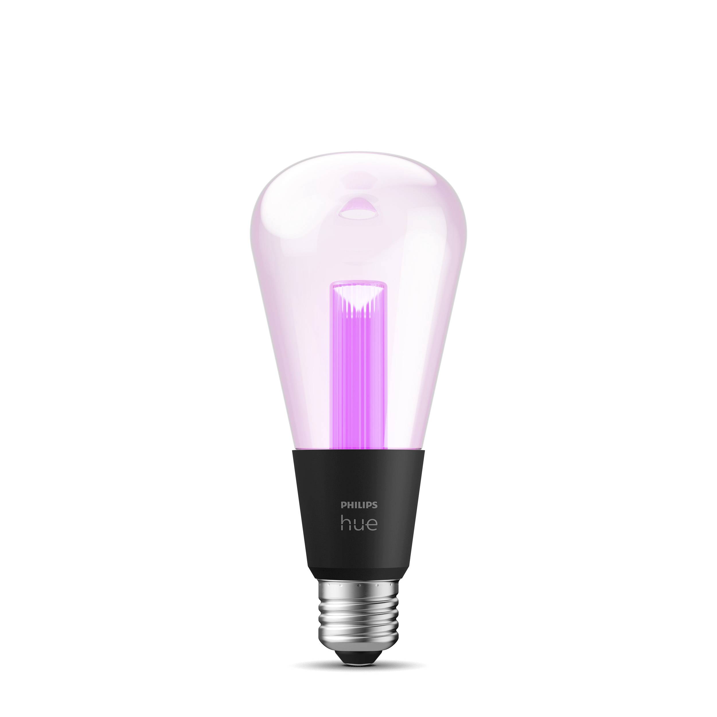 Eine Philips Hue Glühbirne zeigt ein leuchtendes pinkes Licht und hat eine schwarze Basis.