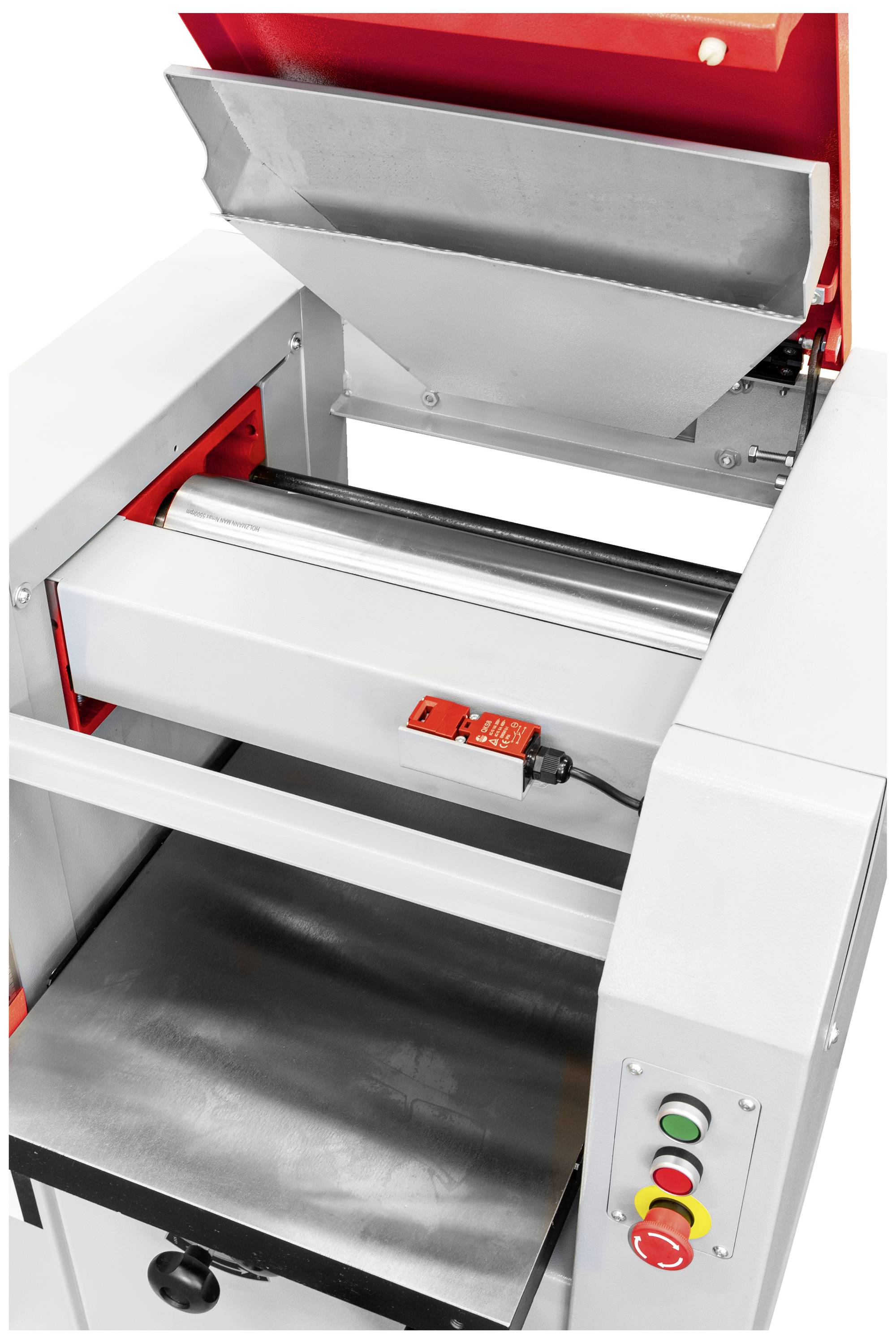 Industrielle Maschine mit offenem Fach, rot-graue Farbtöne, Bedienelemente auf der Seite. Klarer Fokus auf Funktionalität.