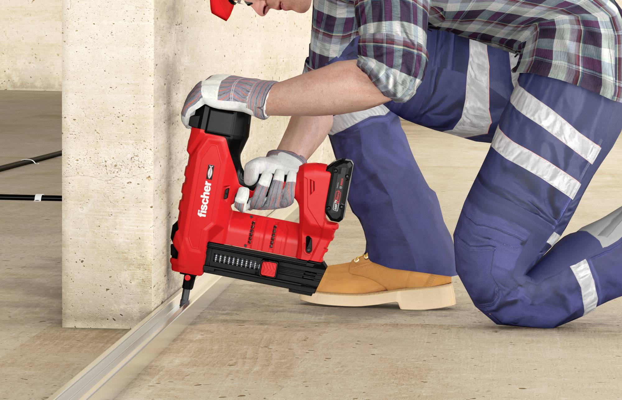 Ein Arbeiter kniet auf dem Boden und befestigt eine Metallleiste an einem Betonpfosten mit einem roten Werkzeug.
