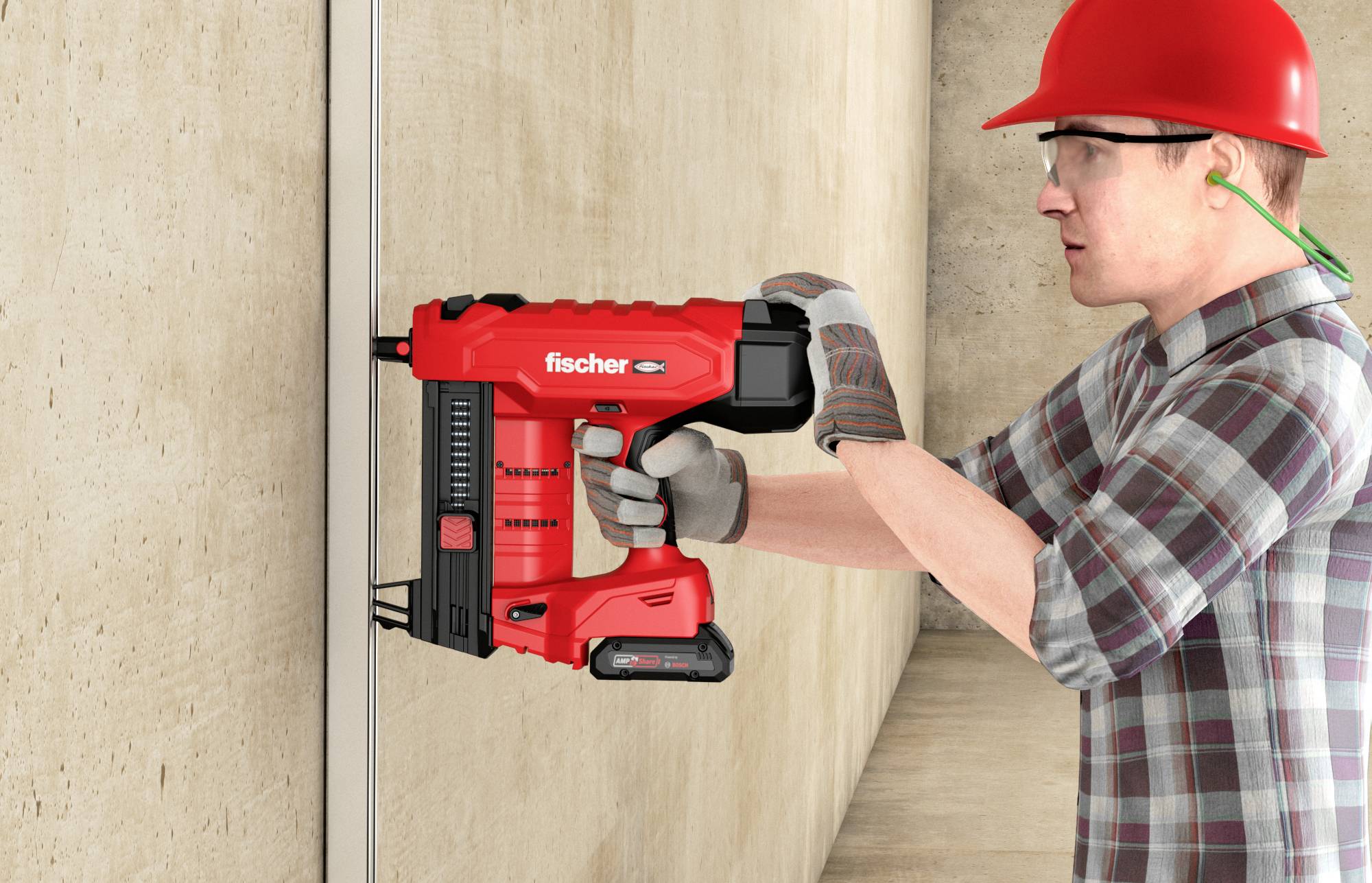 Eine Person in Arbeitskleidung verwendet ein rotes, kabelloses Nagelgerät an einer Betonwand. Sie trägt einen roten Schutzhelm und Handschuhe.