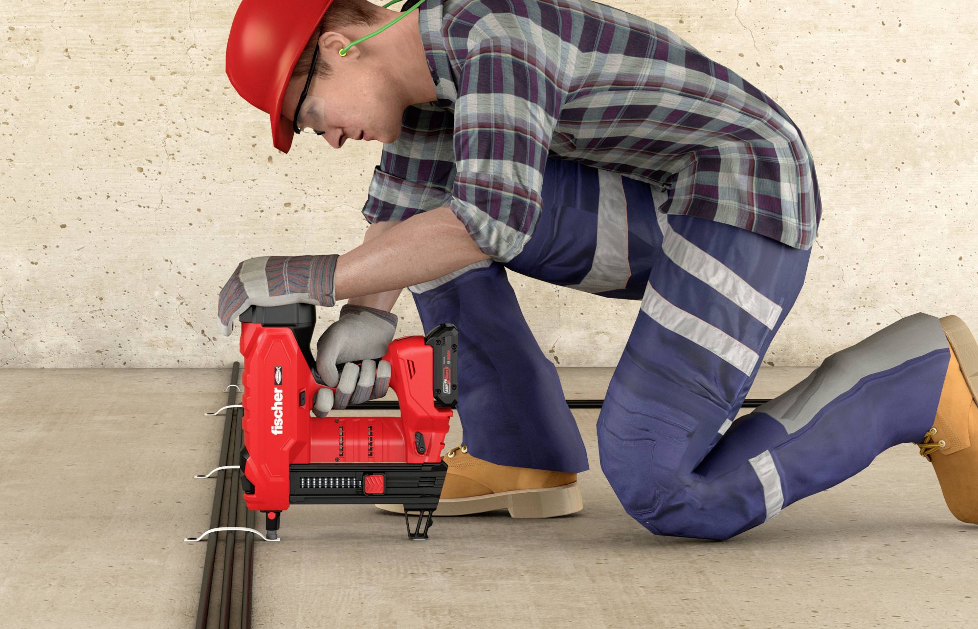 Ein Bauarbeiter in Sicherheitskleidung befestigt mit einem Nagelgerät Kabel am Boden.
