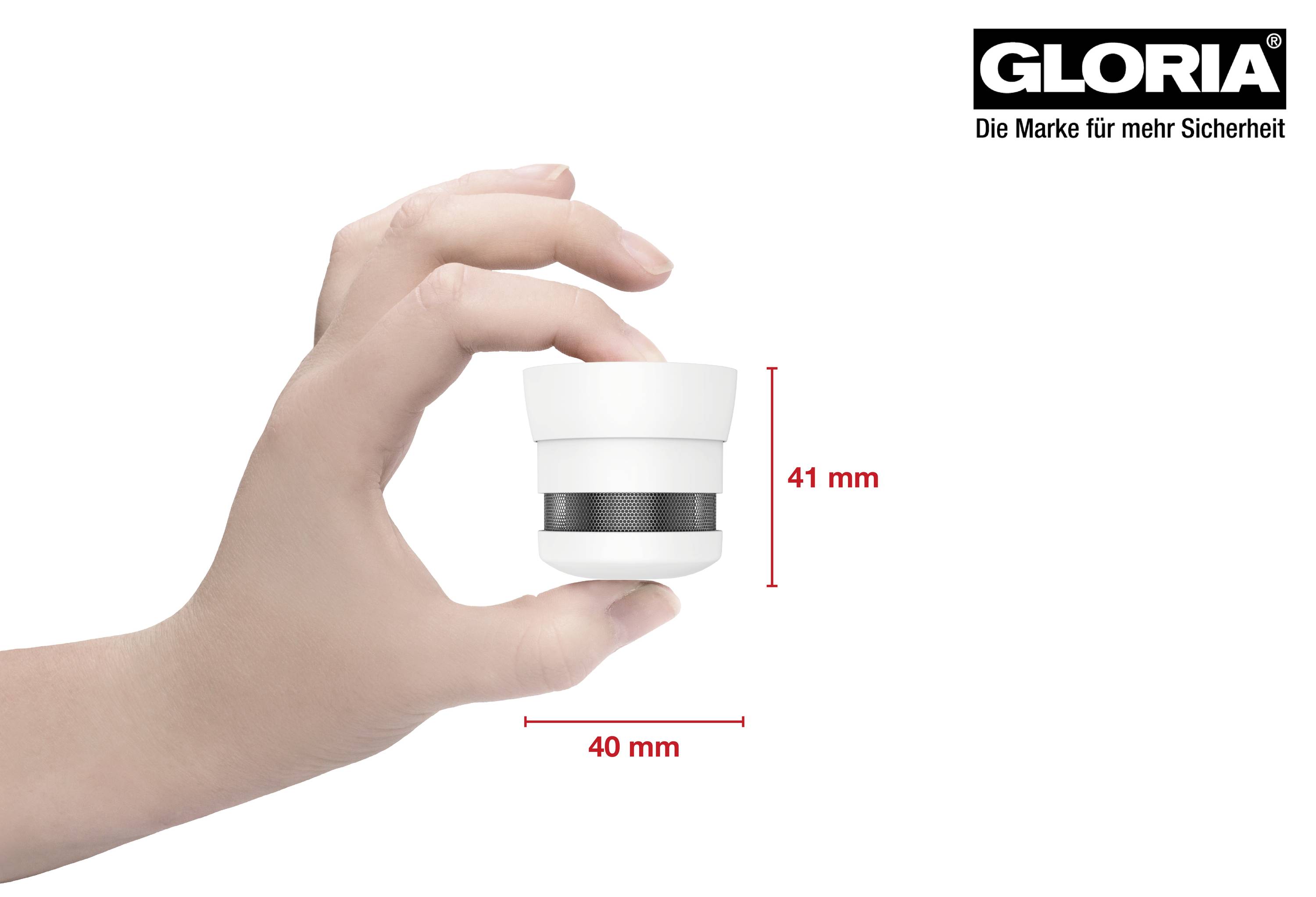 Hand hält einen kompakten Rauchmelder von 41 mm Höhe und 40 mm Durchmesser, Markenlogo 'Gloria' oben rechts.