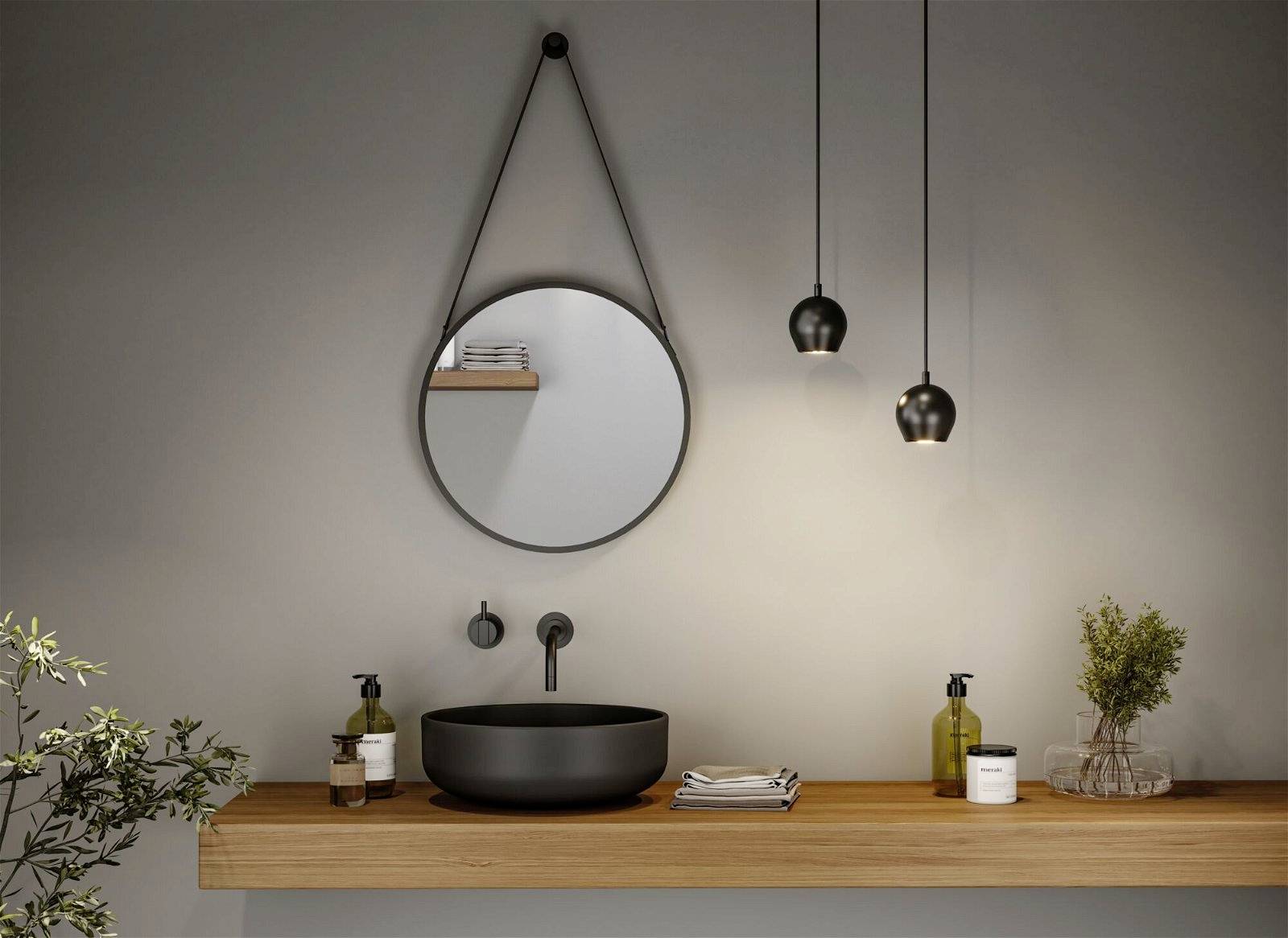 Ein stilvolles Badezimmer mit einem runden Spiegel, einem schwarzen Waschbecken auf einem hölzernen Waschtisch und hängenden Lampen.
