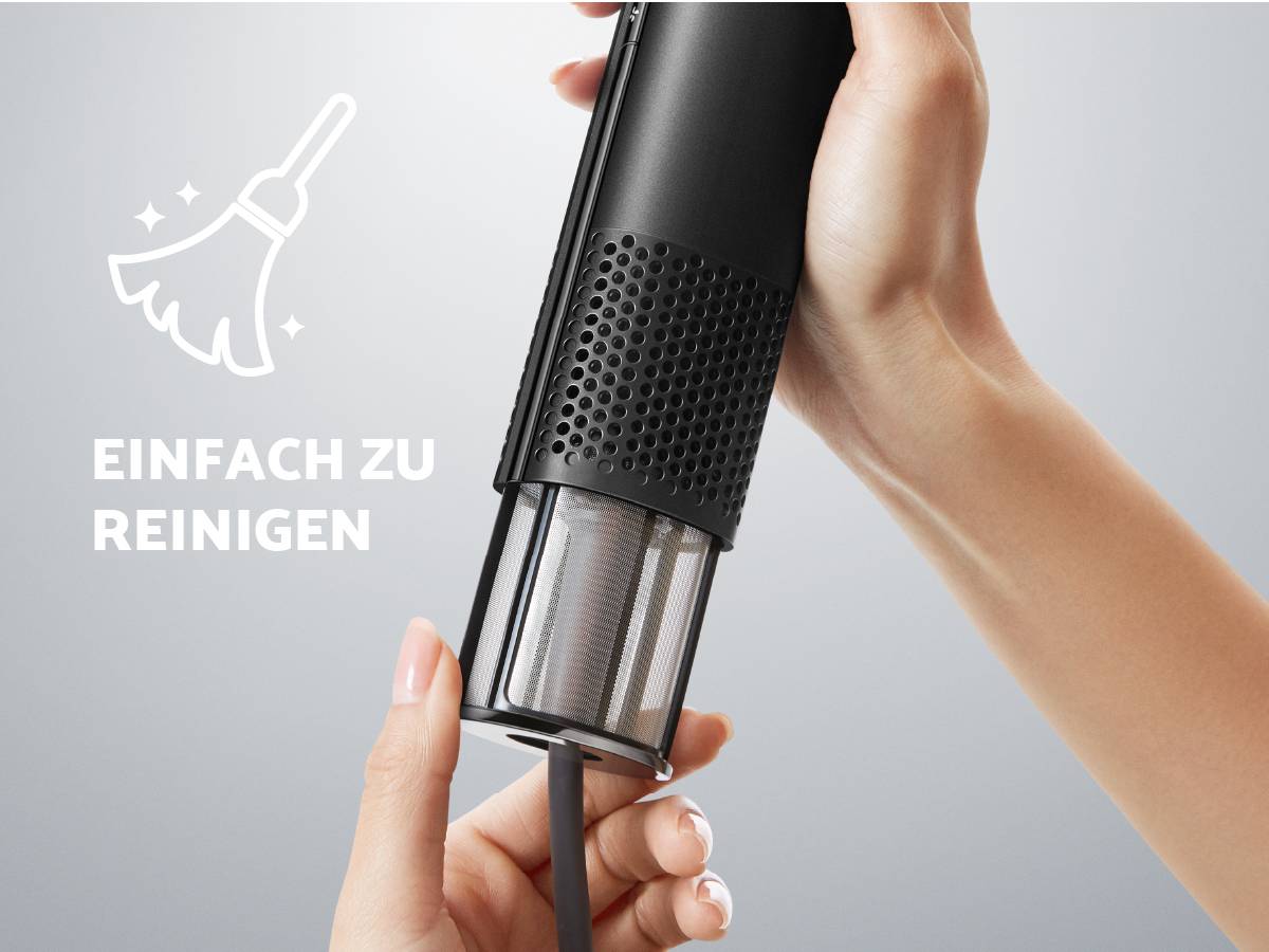 Hände halten einen Staubsauger und entleeren den Schmutzbehälter. Text: 'Einfach zu reinigen'.