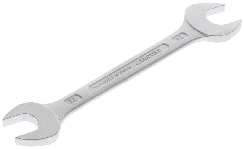 Ein silberner Doppelmaulschlüssel mit den Größen 22 mm und 24 mm, auf hellem Hintergrund liegend. Zubehör für mechanische Arbeiten.