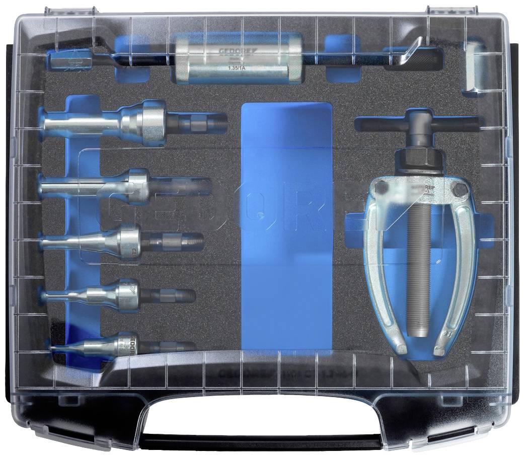 Ein Werkzeugkasten mit verschiedenen Aufsätzen und einem Abzieher, ordentlich in vorgeformten Fächern angeordnet.
