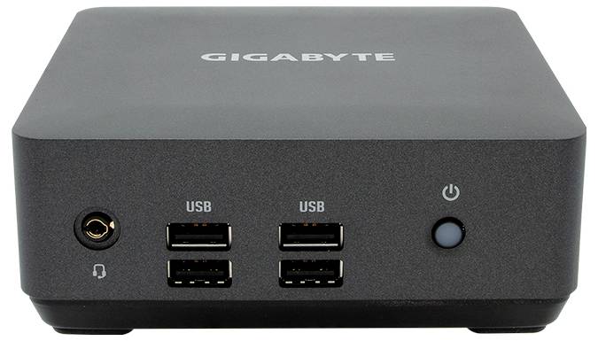 Ein kompakter schwarzer Mini-PC mit vier USB-Anschlüssen, einem Kopfhöreranschluss und einem Netzschalter auf der Vorderseite.