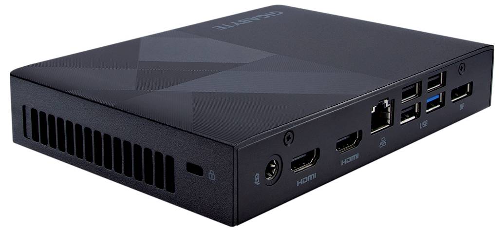 Ein kompakter Computer mit mehreren Anschlüssen: HDMI, USB, Ethernet und Audio. Gehäuse schwarz mit dezentem Muster.