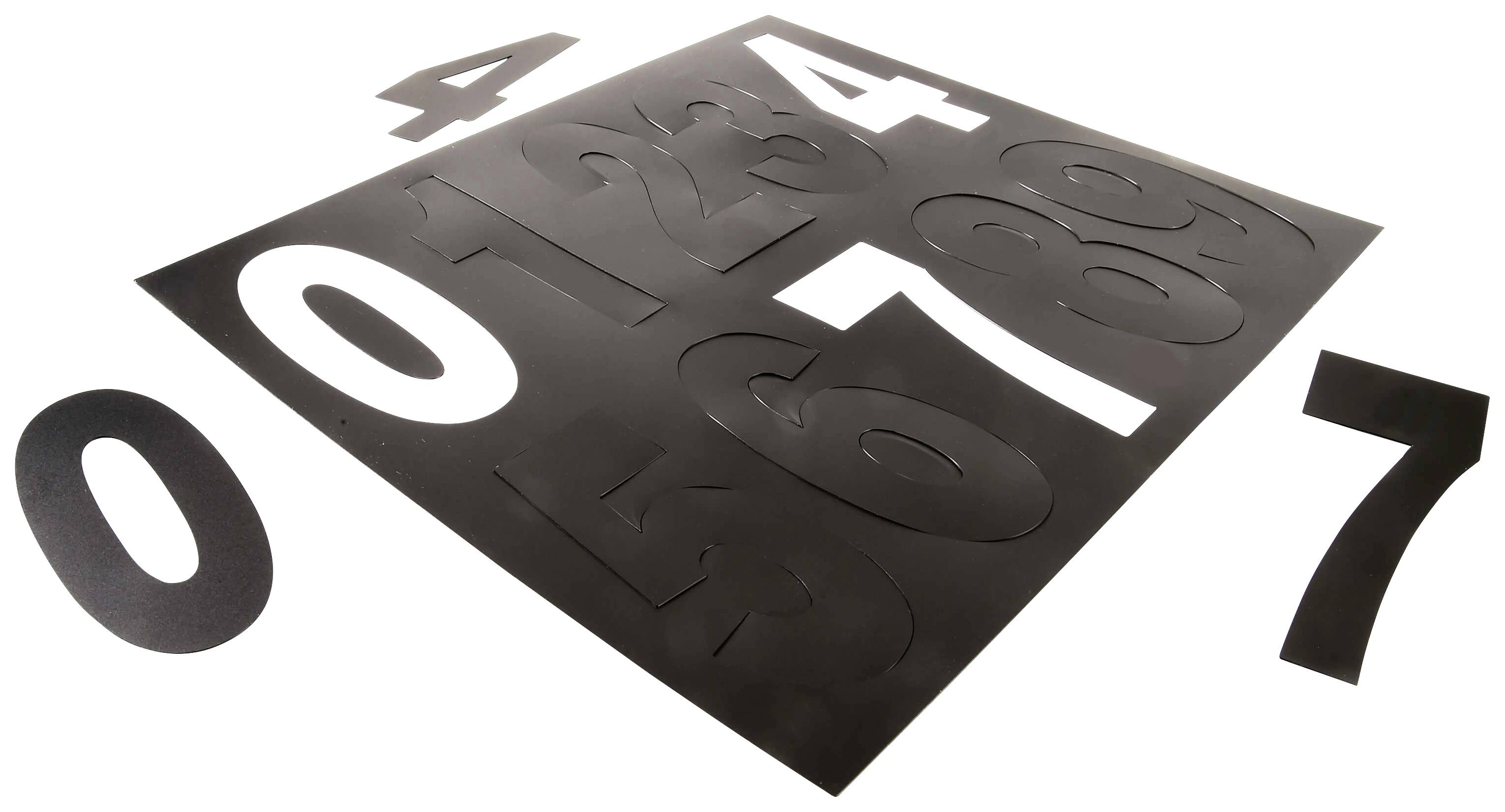 Stencils in Schwarz für Zahlen 0 bis 9 auf einem Tisch, nummeriert.