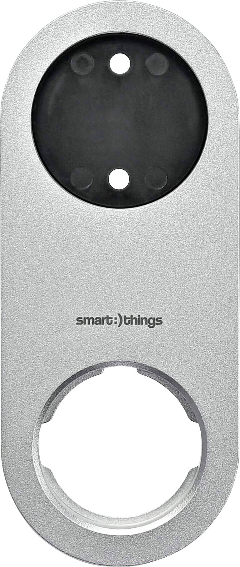 Ein silberner, ovaler Steckdosenadapter mit zwei runden Öffnungen und dem Schriftzug 'smart:)things'.