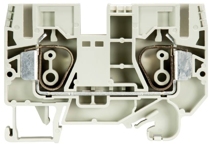 Ein elektrischer Reihenklemmenblock in beige zeigt eine komplexe Innenstruktur mit Metallanschlüssen und mehreren Kammern.