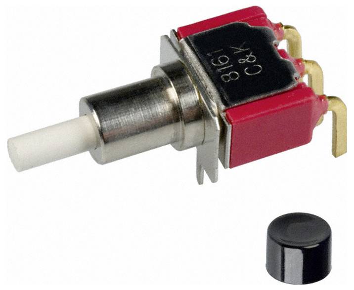 Ein kleiner roter Metall-Druckschalter mit Goldkontakten, gezeigt mit einer separaten schwarzen Kappe zum Abdecken des Knopfes.