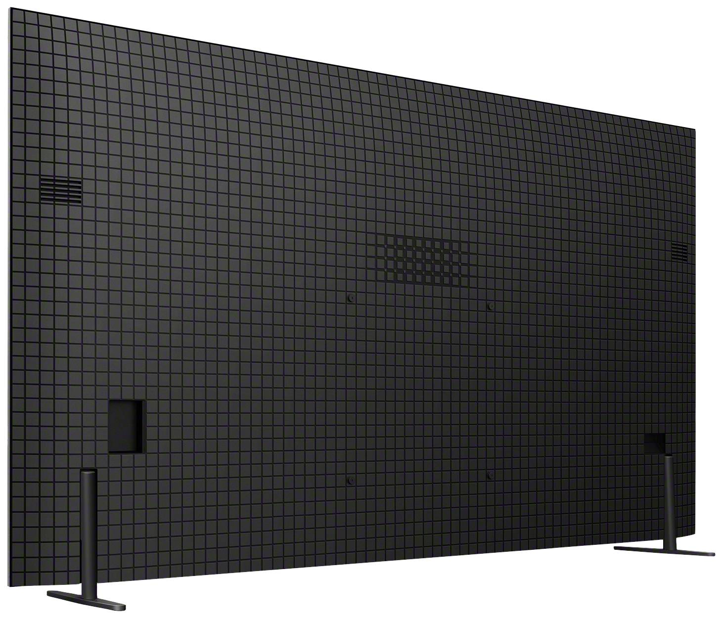 Eine große, schwarze LED-Anzeigetafel von hinten, die auf zwei Ständern steht und eine gitterartige Struktur aufweist.