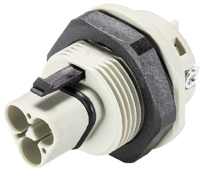 Ein grauer und schwarzer Zylinder mit zwei Anschlussöffnungen und einem kleinen Hebelmechanismus, für industrielle oder elektrische Anwendungen geeignet.