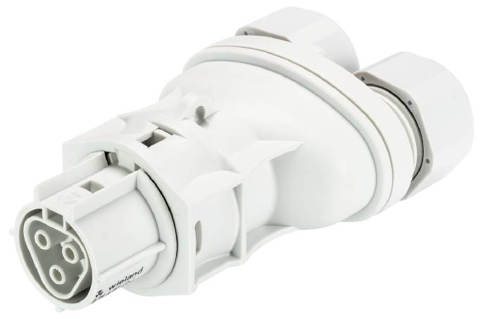 Ein weißer elektrischer Adapterstecker mit mehreren kreisförmigen Anschlüssen, geeignet für industrielle Anwendungen.