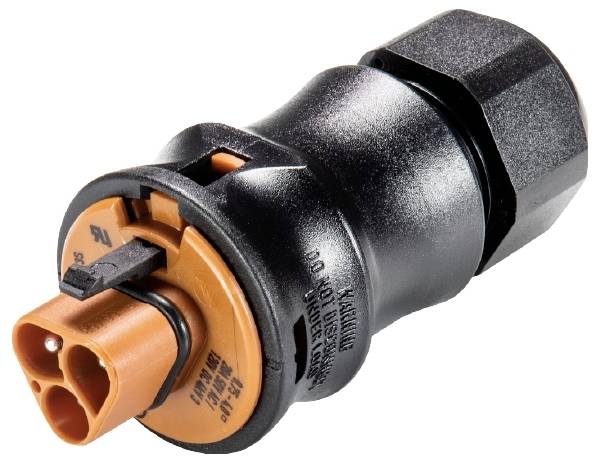 Ein schwarzer und orangefarbener Steckverbinder, zylindrisch geformt, zeigt Kontaktstifte für elektrische Verbindungen.