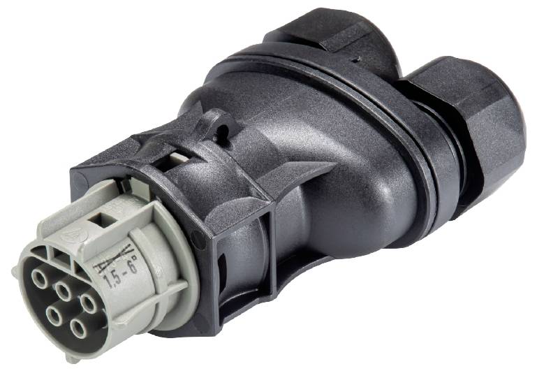 Ein schwarzer, vielförmiger Adapter mit mehreren Anschlussstiften, wahrscheinlich für elektrische oder elektronische Verbindungen.