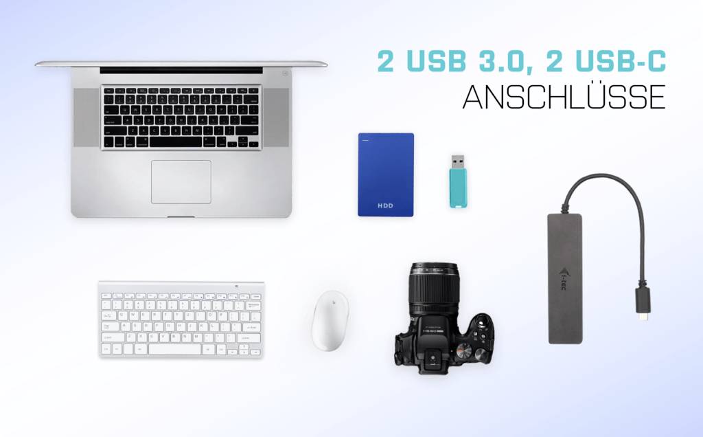 Ein Laptop mit Tastatur, Maus, Kamera, Festplatte, USB-Stick und USB-C-Adapter. Text: '2 USB 3.0, 2 USB-C Anschlüsse'.