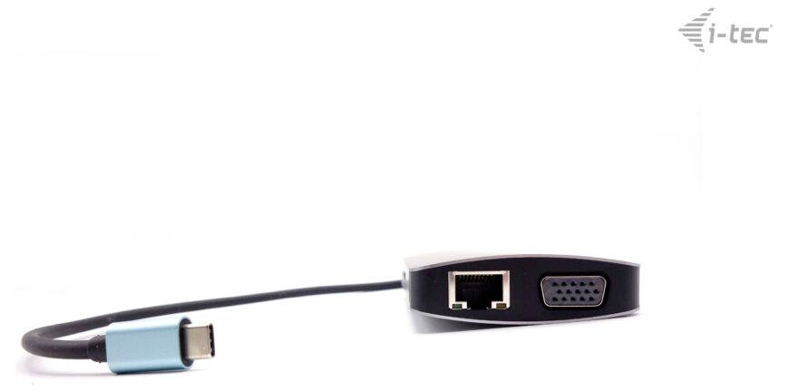 Ein Adapter mit USB-C-Anschluss und RJ-45/Ethernet- sowie VGA-Port. Marke 'i-tec' oben rechts im Bild.