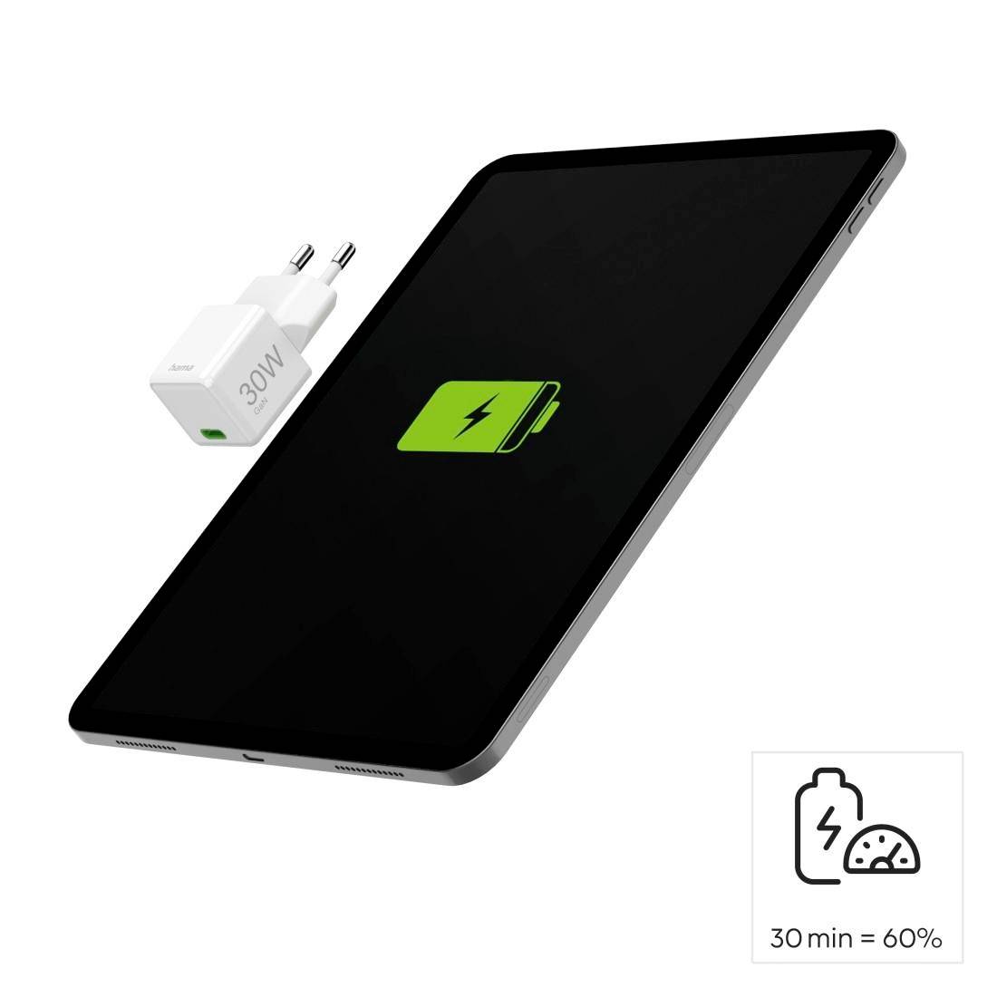 Tablet mit Ladesymbol auf dem Bildschirm und ein Ladegerät daneben. Beschriftung besagt '30 min = 60%'.