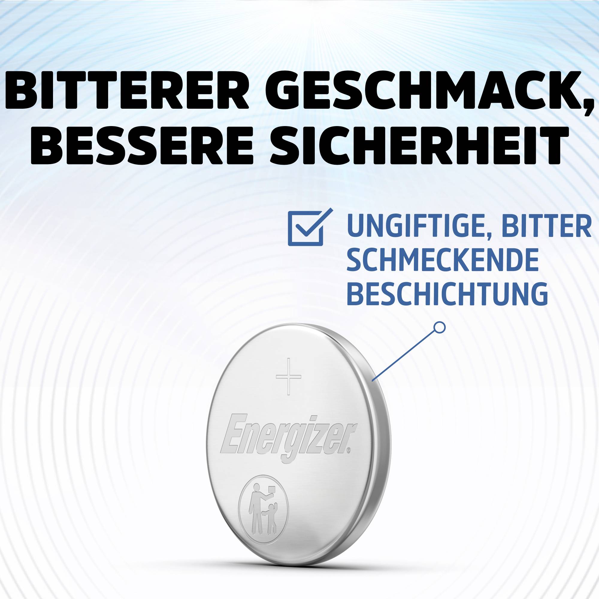 Silberne Knopfzellenbatterie mit Prägung 'Energizer' und 'ungiftige, bitter schmeckende Beschichtung' hervorgehoben. Text oben: 'Bitterer Geschmack, bessere Sicherheit'.