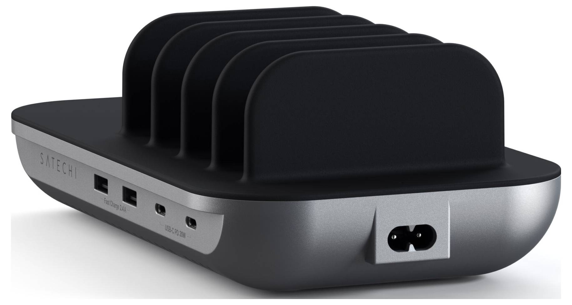 Schwarze Ladestation mit mehreren USB-Anschlüssen, um mehrere Geräte gleichzeitig zu laden. Rechteckige Form mit gewellter Oberseite.