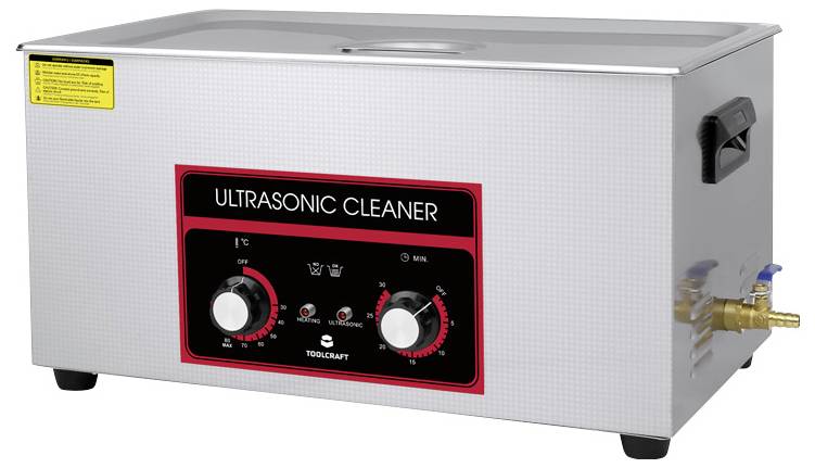 Ultraschallreiniger mit zwei Drehknöpfen zur Temperatureinstellung und Laufzeitsteuerung, Metallgehäuse mit Wasserablaufanschluss.