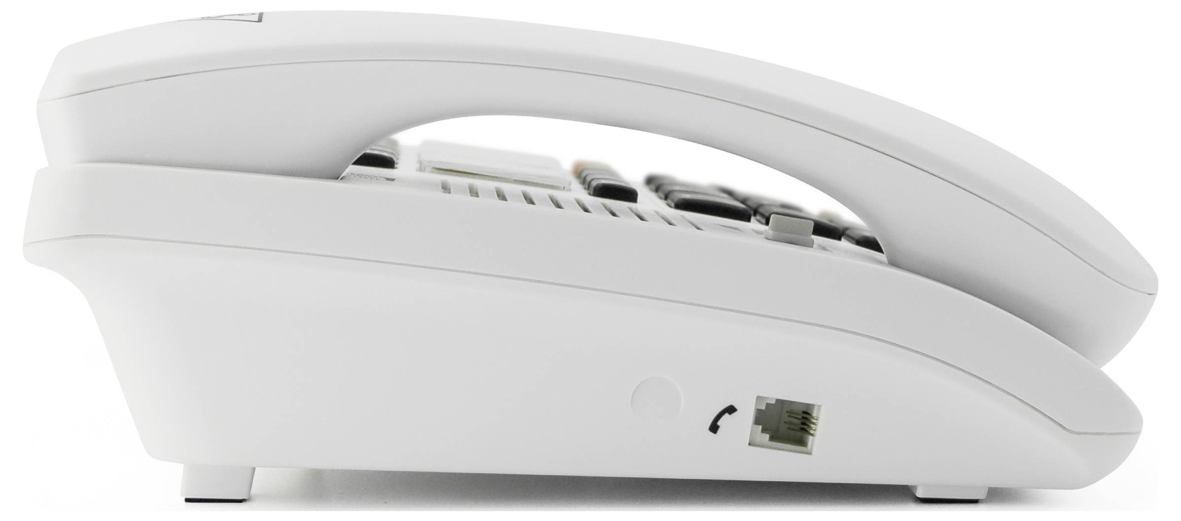Ein weißes Festnetztelefon von der Seite, mit erkennbarer Telefonhörer-Gabel und einem Anschluss für das Telefonkabel auf der Unterseite.