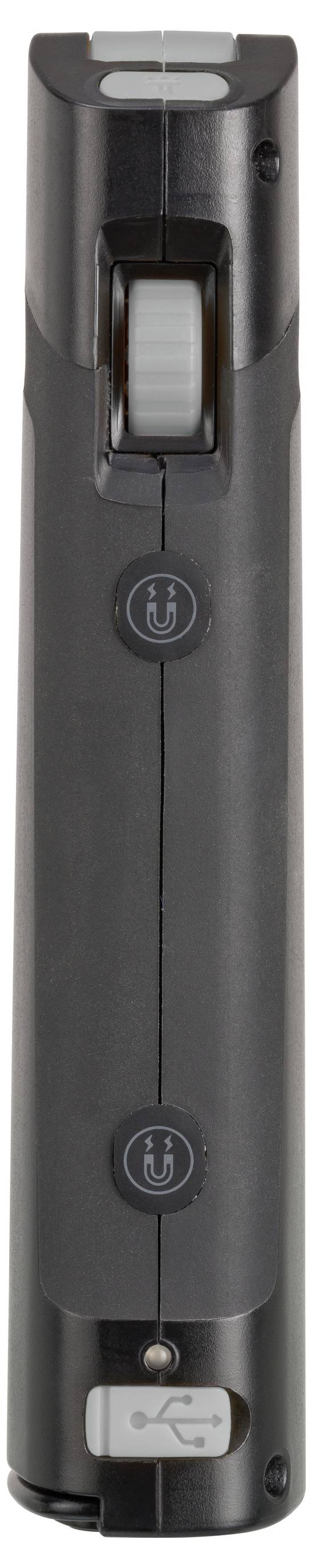 Nahaufnahme eines schwarzen tragbaren Geräts mit einem großen zentralen Rad, zwei kreisförmigen Tasten und einem USB-Anschluss unten.