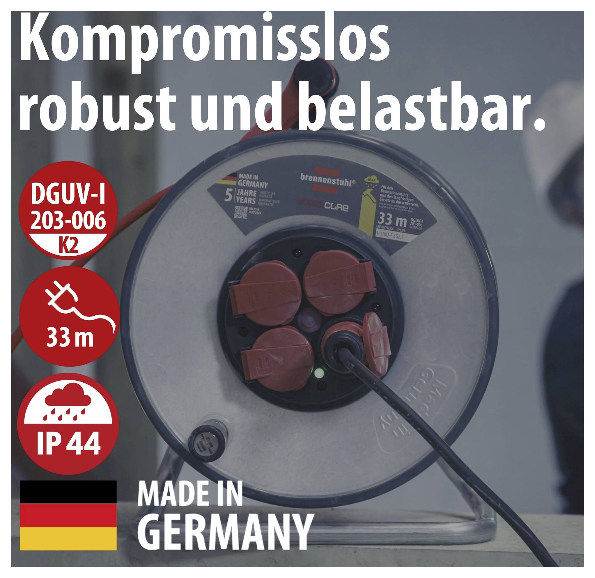 Werbeanzeige eines robusten Kabeltrommel-Produkts mit Text 'Kompromisslos robust und belastbar.', Kennzeichen DGUV-I 203-006, 33 m, IP44 und 'Made in Germany'.