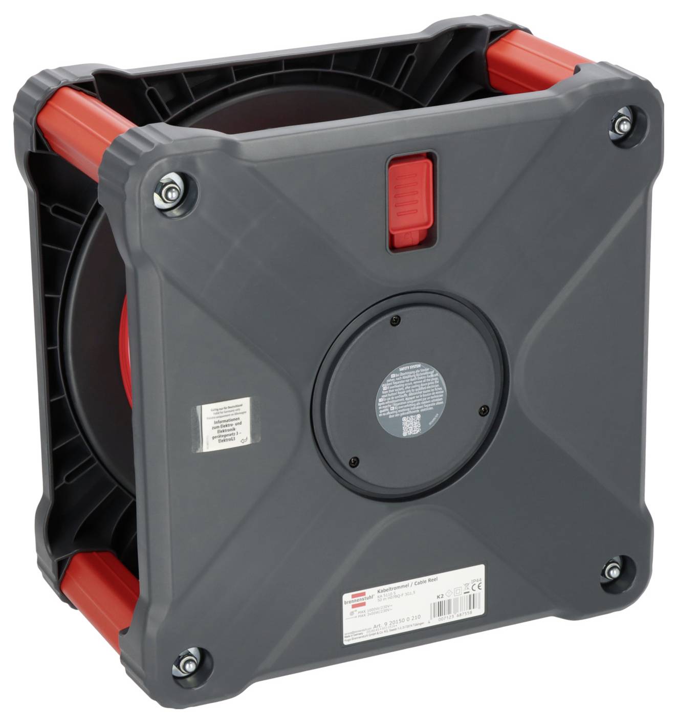 Ein grauer, quadratischer Kabeltrommel-Koffer mit roten Griffen und einem zentralen, runden Aufkleber.
