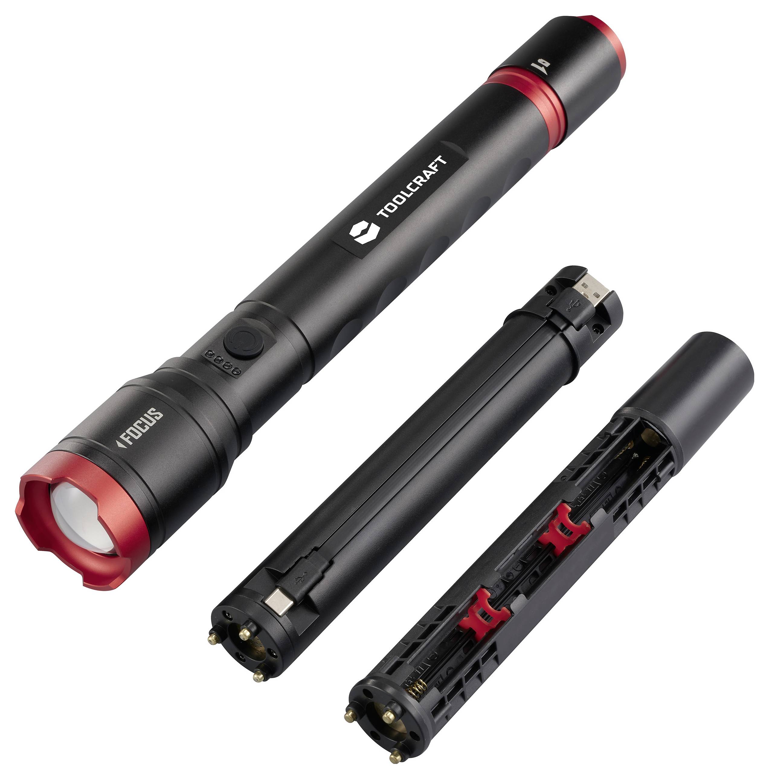 Schwarze Taschenlampe mit rotem Rand, auseinandergebaut in drei Teile: Hauptgehäuse, Batteriefach, Endkappe. Marke 'Toolcraft'.